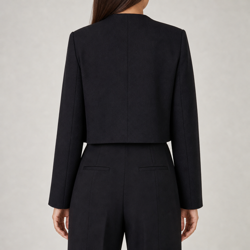 Women's cropped jacket with gold buttons and pocket detail in black – back view